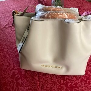 Dooney and Bourke brand new bag. Never used. Cream color. Large bag